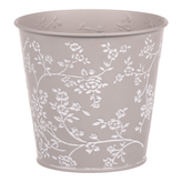 Obal kovový v šedivé barvě s bílými růžemi.