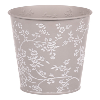 Obal kovový v šedivé barvě s bílými růžemi.