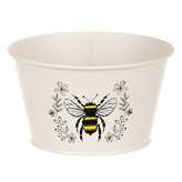 Obal kovový, krémová barva s včelkou.