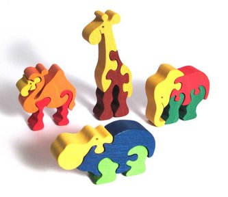 Fauna Dřevěné vkládací puzzle z masivu sada zoo 4 ks Fauna Dřevěné vkládací puzzle z masivu sada zoo 4 ks